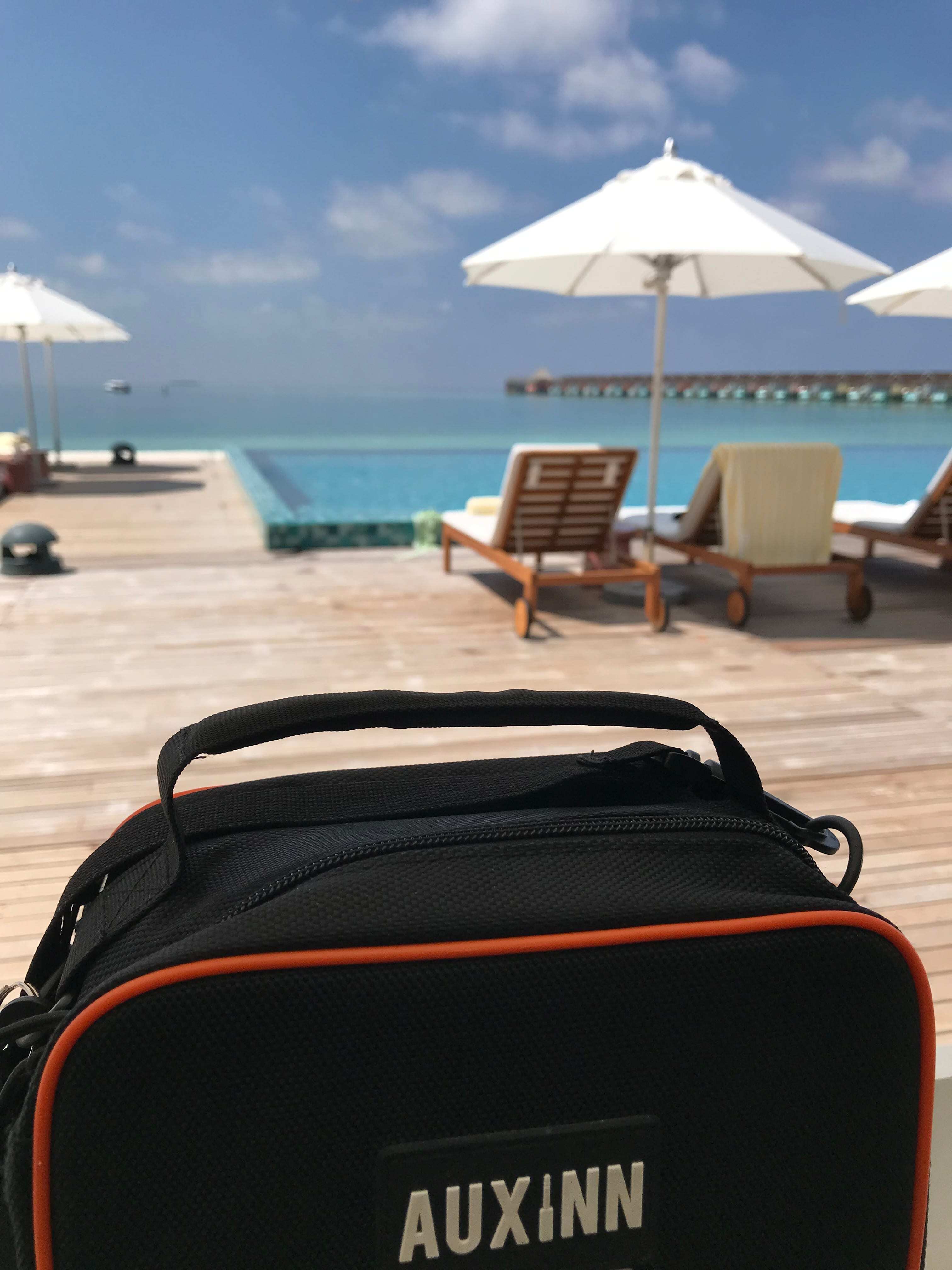 Auxinn bag at a poolside venue installation